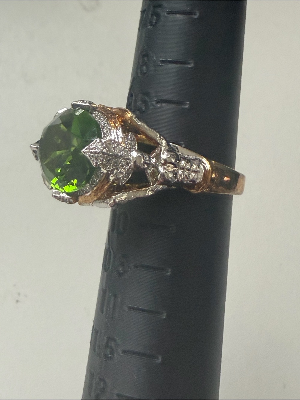 Oval Green Gemstone Cocktail Ring with Decorative Metal Accents